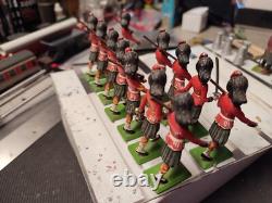 11 Scottish soldiers + one officer at the parade, British