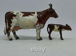 Britains hollow-cast lead 54mm Ayrshire bull (#784) cow (#785) and calf (#786)
