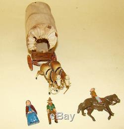 Early lead Taylor & Barrett Cowboy Pioneer Wagon + seated man & woman & outrider